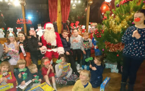 Santa giving out gifts at community event
