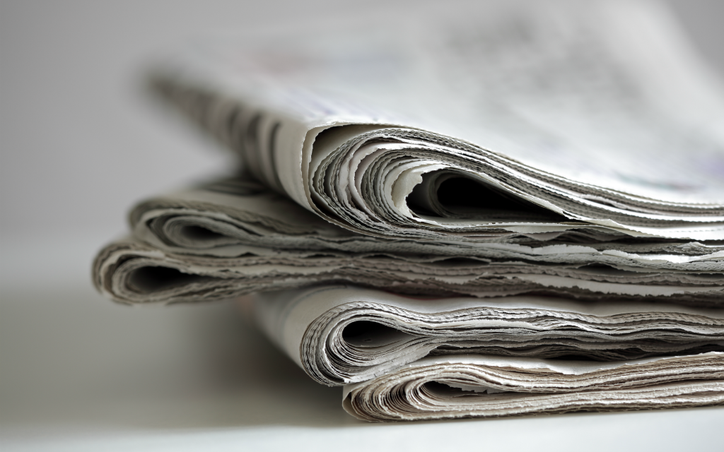 Stacked up newspapers